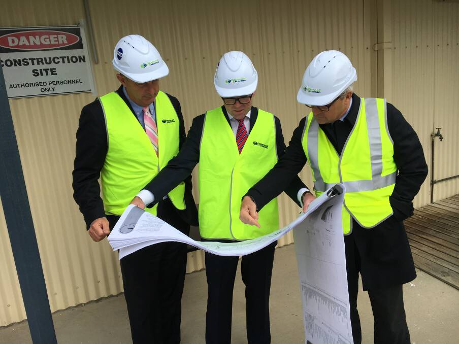 FUTURE LEARNING: Upper Hunter MP Michael Johnsen, Adam Marshall and TAFE NSW managing director Jon Black look over the plans for the new CLC.