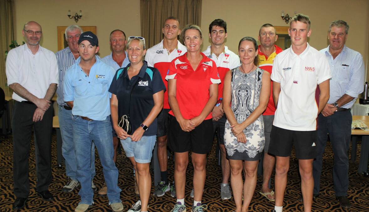 Sydney Swans players Shaun Edwards and George Hewett (back, middle) met with Moree Plains Shire councillors and Moree Suns AFL Club members and sponsors on Monday.