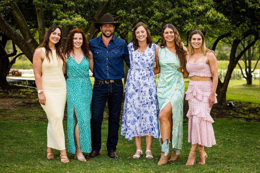 Farmer Todd (in the hat) with the five ladies of his choosing, none of which are wearing hats here, as Todd's is providing enough shade for all. Picture supplied