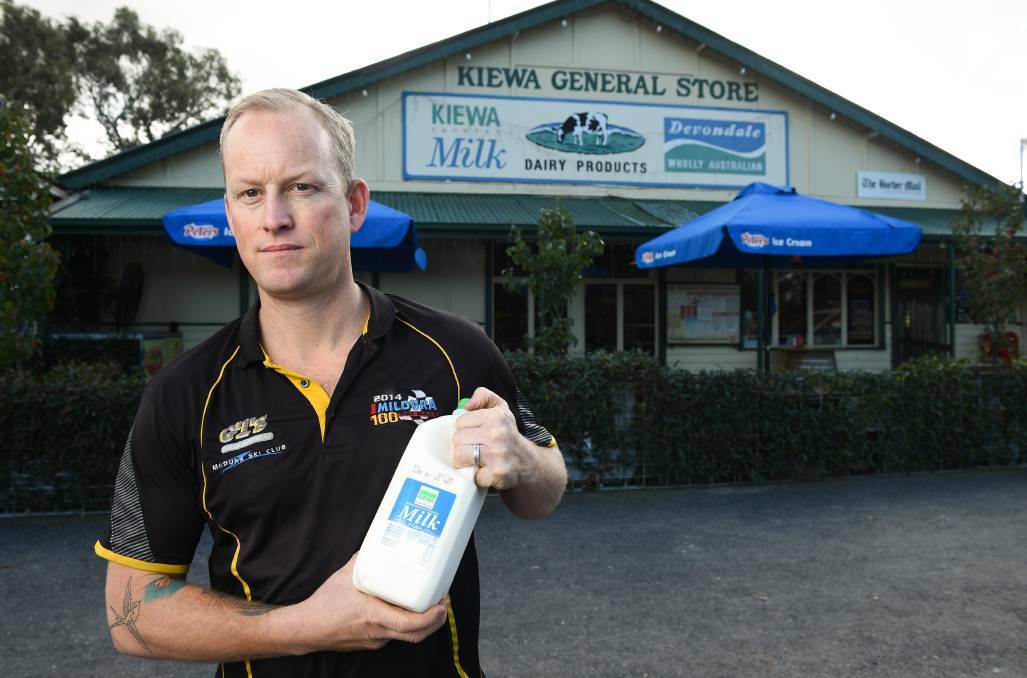 Brendon Arundel outside his store. He does not want to see Kiewa Country disappear from the labels of milk sold at his shop.