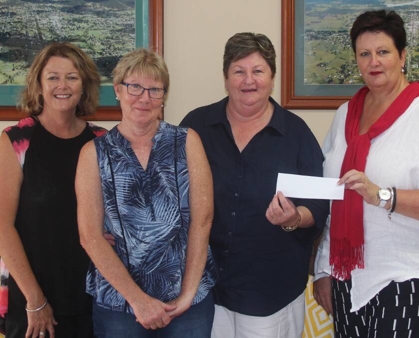 Secretary Wendy Kings (far right) presents the $1000 donation to local Cancer Council members Thea Mackenzie, Jenny Condrick and Tania Larkin.