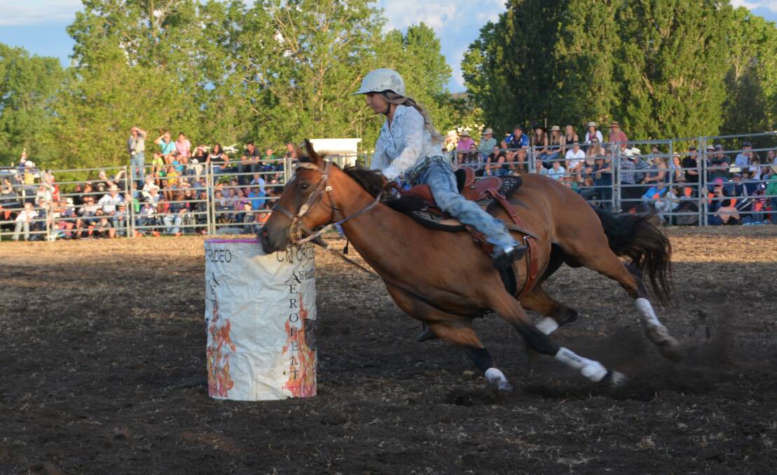 LEANING INTO IT: Cassidy Howard of Woodford in 'Rebate' digs into the corner in the Junior Barrel Race.