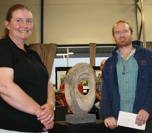 Sponsor Kerri Swain with winner of the $250 3D prize Richard Pfeiffer and his stone sculpture titled "Washpool".
