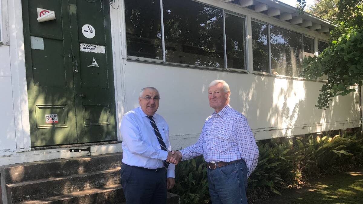 The heritage grant to restore the Isolation Ward at Tenterfield Hosptial realises a 15-year dream for Dr Ian Unsworth (on right), being congratulated by MP Thomas George.