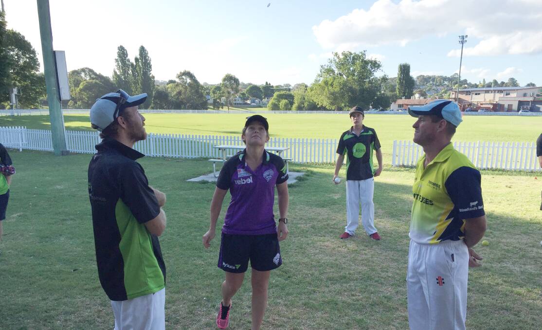 CALL IT: Corrine Hall does the coin toss in the first match of the semifinals during her visit, with Short Fuses sending KLAS Bouncers in to bat.