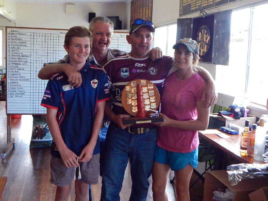 RANDOM SELECTION: Terry Clements (rear) with winners Oliver Downham, Brad Downham and Kiara Whalen.