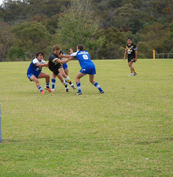 Jacob Harding fights off
defenders in a Tigers' push
for the try line in the win
against Stanthorpe
Gremlins on Saturday.