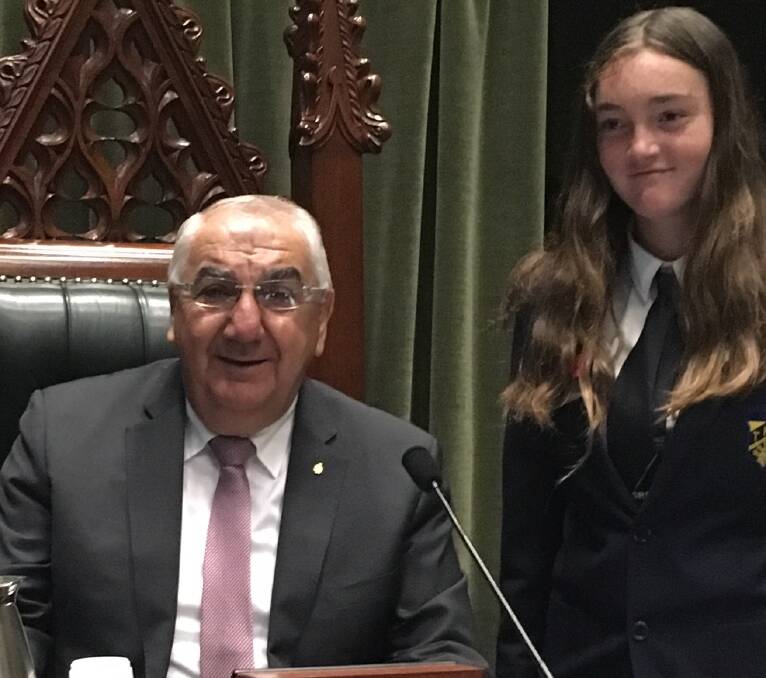 CREDIT DUE: Ella Wishart with her local MP (and debate moderator) Thomas George.