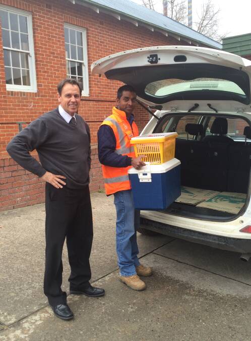Corporate services director Allan Shorter and acting engineering technical officer Alex Day take their turn on Meals On Wheels delivery.