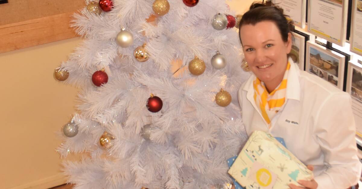 GIFT OF GIVING: Ray White Tenterfield's Belinda Dockrill is one of the team members helping to spread a ray of sunshine to disadvantaged families this Christmas.