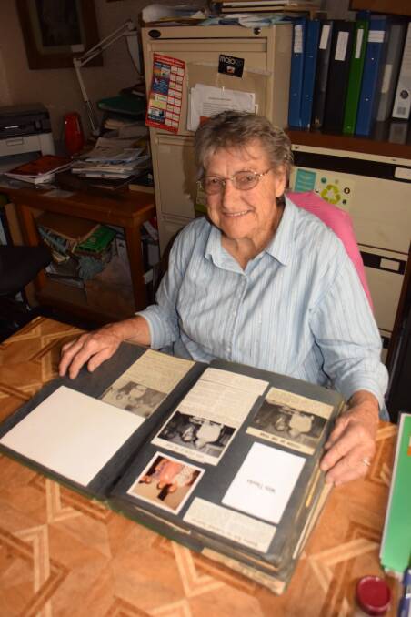 SCRAPBOOK OF MEMORIES: Quota member Daphne Struck has some of the club's memorabilia in safekeeping at Centenary Cottage Museum, and it's available for viewing.