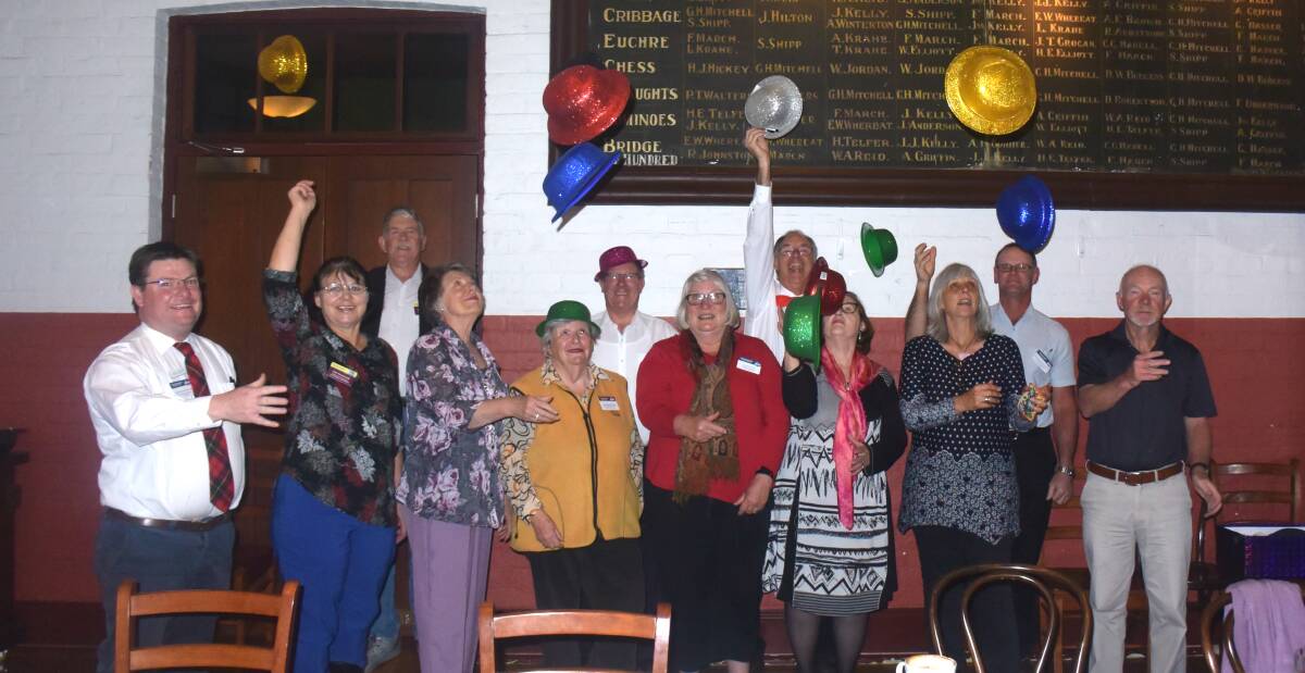 LET'S CELEBRATE: In the party mode were (at back) Tony Harslett, Logan Steele, Peter Van Schaik and Trevor Fitness, and (at front) Peter Duncan, Julia Hassall, Susan Butterworth, Linda Tighe, Jan Evans, Pam Docherty, Karen McLean and Keith Barnett.