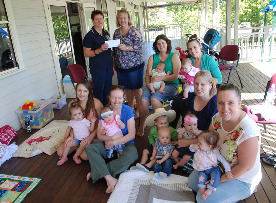 Tenterfield CWA's Mary Hennessy presents a cheque to playgroup president Lisa Baguley to support the new playgroup that meets on Friday mornings at the RSL Pavilion.