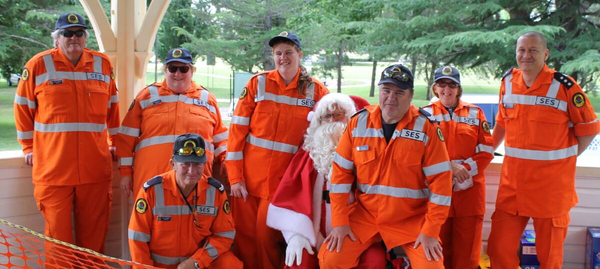SES volunteers Kim Plowman, Caron Miller, Lyndel Miller, Vicky Smith and Richard Dennison along with (at front) Ian Stewart and Guy Miller were on-hand for Santa-wrangling services at last year's carnival.