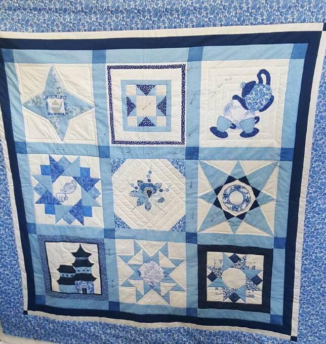 COMFORT QUILT: This gorgeous quilt is just one of the latest of the 373 charity quilts produced by the Tenterfield Arts and Craft Society over the past seven years.