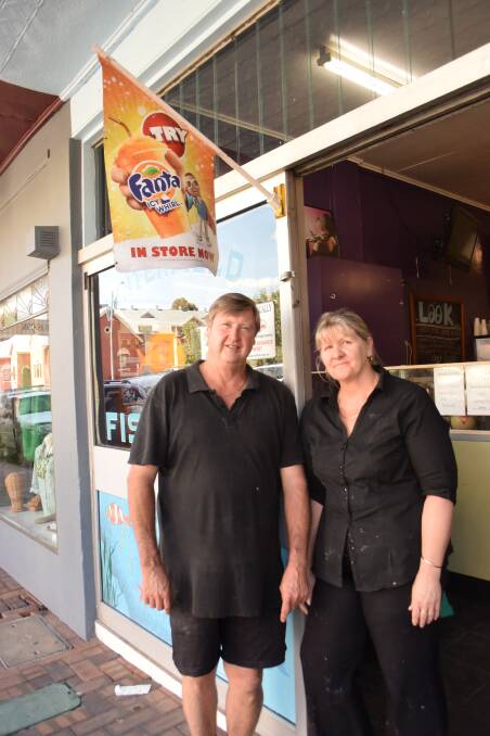PUTTING IT OUT THERE: Jeff and Carole Smith of the Tenterfield Fish Shop continue to fly their flag in defiance.