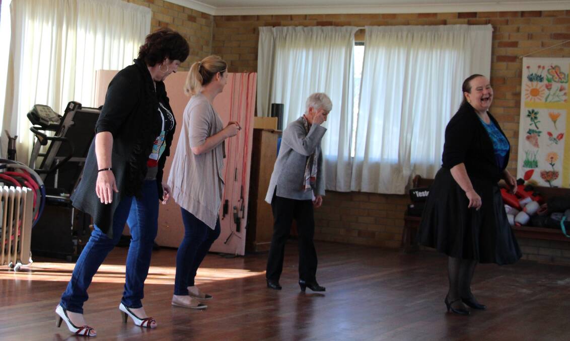 STEP LIVELY: There are plenty of laughs as instructor Phyllus Jones leads Maria Sciuto, Karen Wells and Beryl Dean during a recent rock-and-roll dance class.