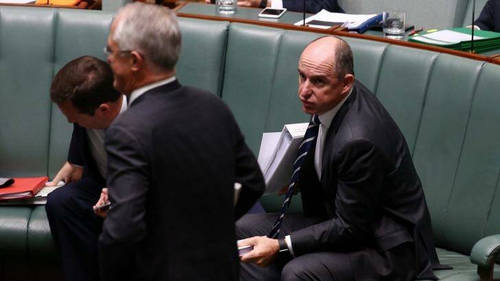 Prime Minister Malcolm Turnbull passes minister Stuart Robert at the end of question time on Monday. Photo: Andrew Meares