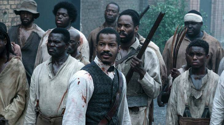 Nate Parker as Nat Turner, center, in a scene from The Birth of a Nation. Photo: Jahi Chikwendiu