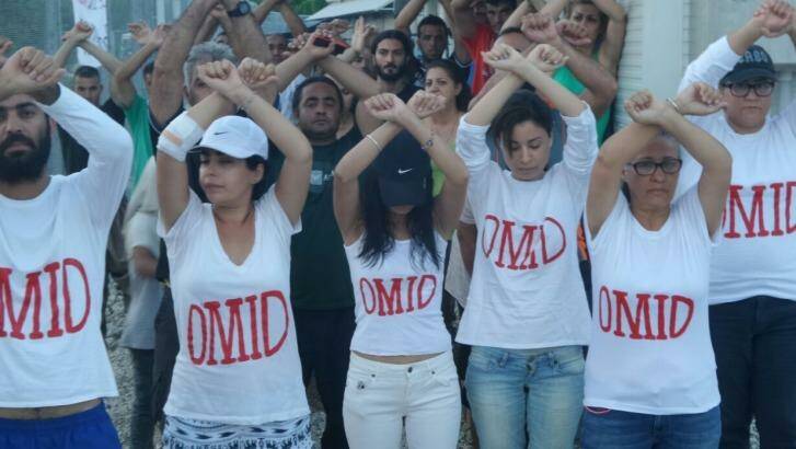 Refugees at Nauru wear t-shirts with Omid's name as a show of solidarity.