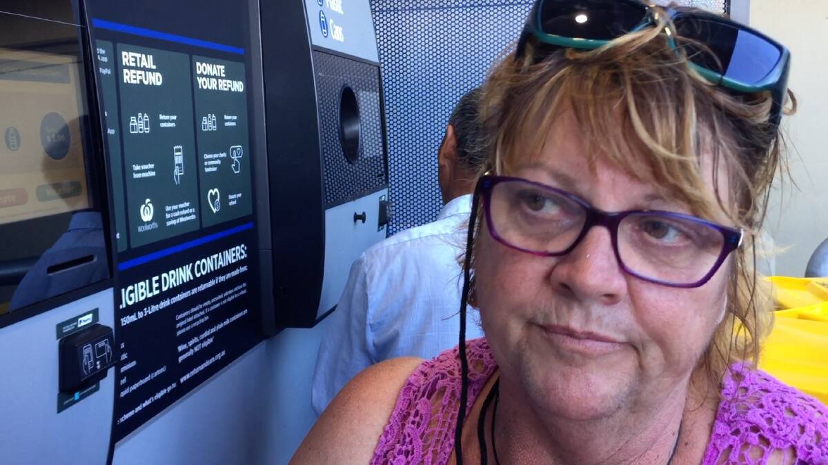CASHING IN: Michelle Lockwood put about 300 cans into Glen Innes' new reverse vending machine in its first week of operation. A similar machine will be installed in Tenterfield soon.