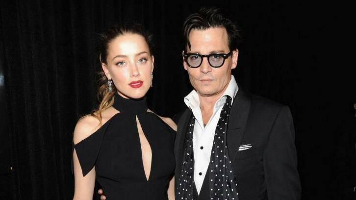 Amber Heard with fiance Johnny Depp in May this year.