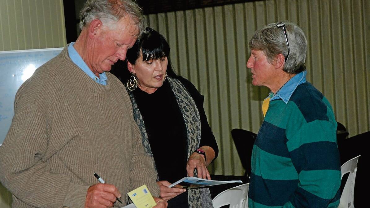 CALL TO ACTION: NSW Farmers members Peter Jeffrey, Bronwyn Petrie and Sandra Smith discuss the draft Native Vegetation Act at the recent Tenterfield meeting.