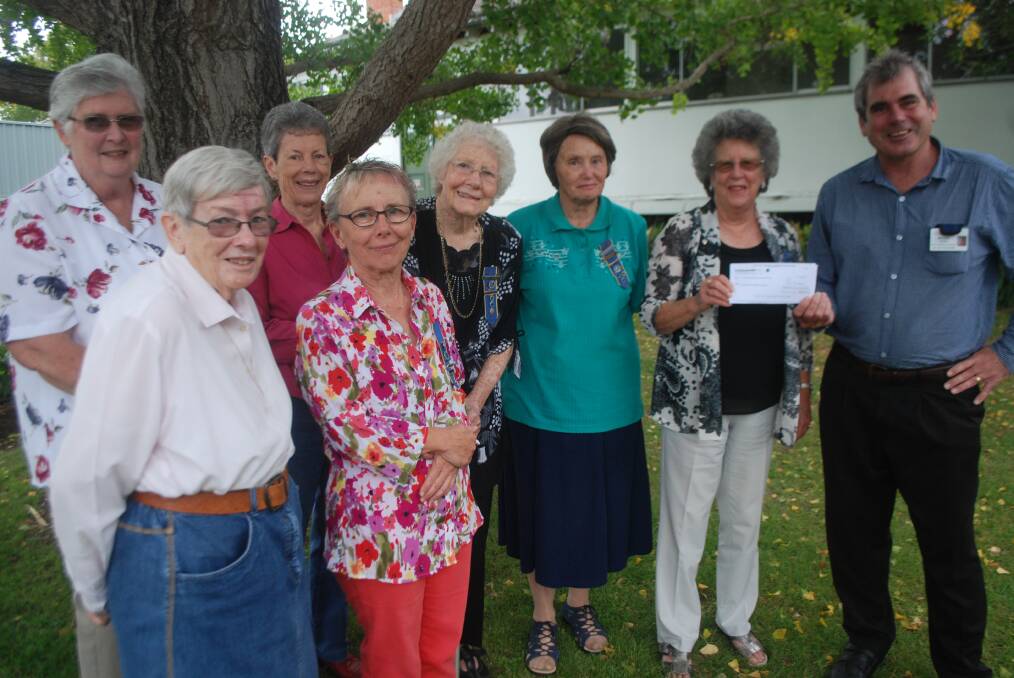 Di Watson, Anne Stark, Val Mitchell, Karin Janik, Joyce Butler, Heather Woolnough, Janet Hayne and health service boss Michael Moore were present for the cheque handover. 