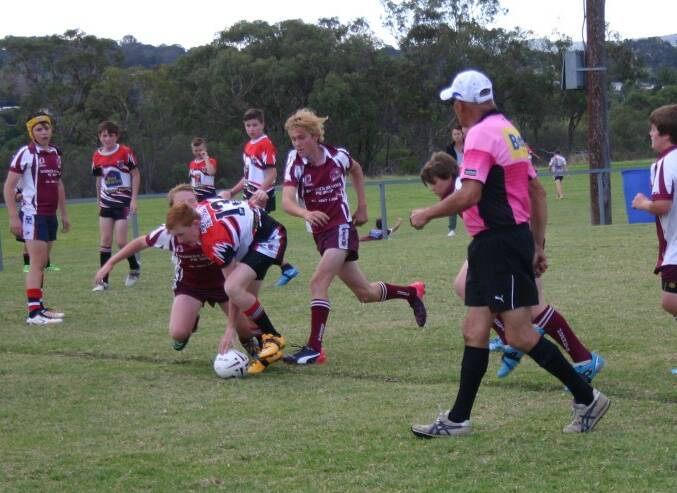 Kynan Koch scores a try in the Under 14s Tigers game against Warwick Suburbs.