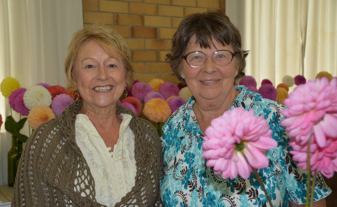 GROWING SPECTACULAR: Shirley Lewis and Fay Bohn among the colour of Saturday’s Dahlia and Cut Flower Show.