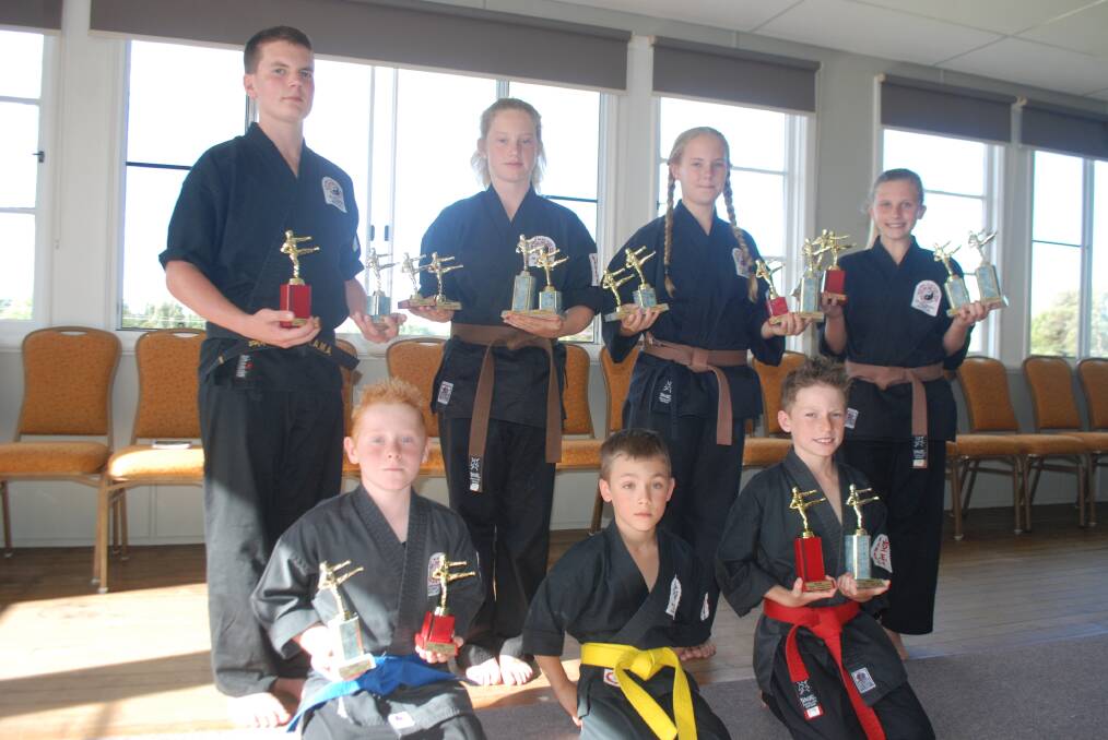 KARATE HONOURS: Joseph Blackler, Muraya Horan, Alicia Smith and Jade Shearer (back); Robert Bridge, Cameron Donadel and Jake Gibbins (front) have recenlty returned from New Zealand with a swag of honours and are now looking for new members to join the local club.
