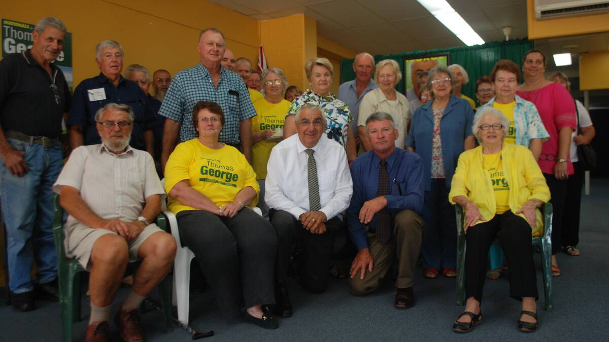 Thomas George (centre) at his office open in Tenterfield.
