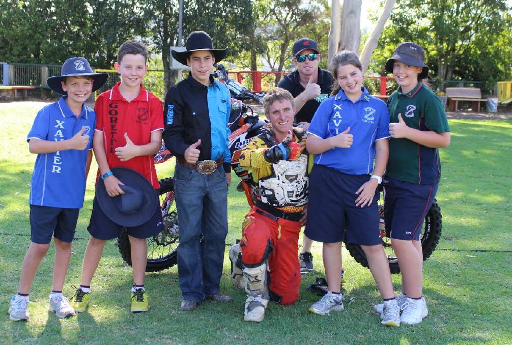Brodie Carmichael (centre) with Jed Townes behind him. The pair took their show to a school in Toowoomba last week. 