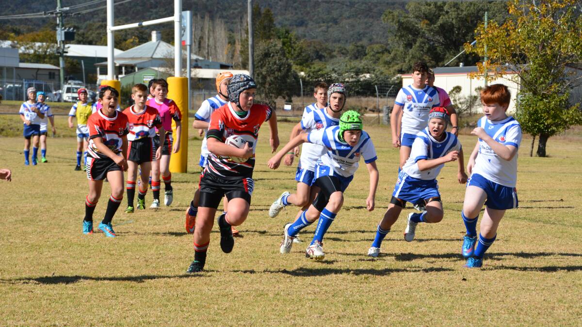 Border Bears under 12’s player Isaac Jones tries to bypass the Collegians defence and head for the corner post. 