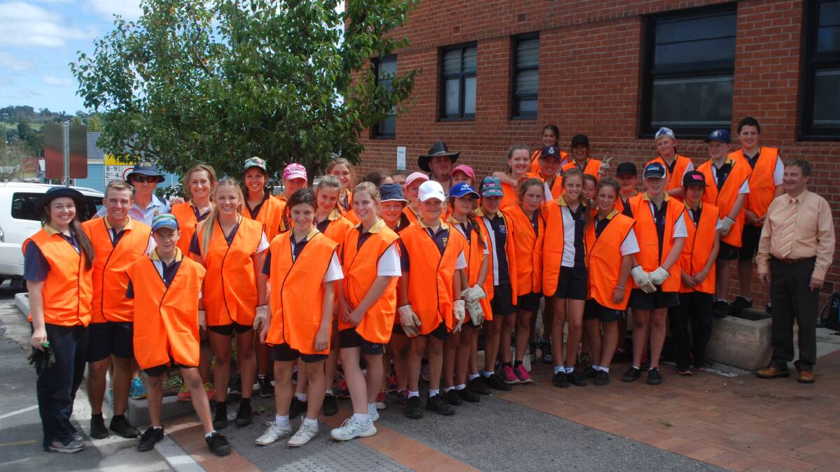 Tenterfield High School students get their hands dirty installing plants along the main street.