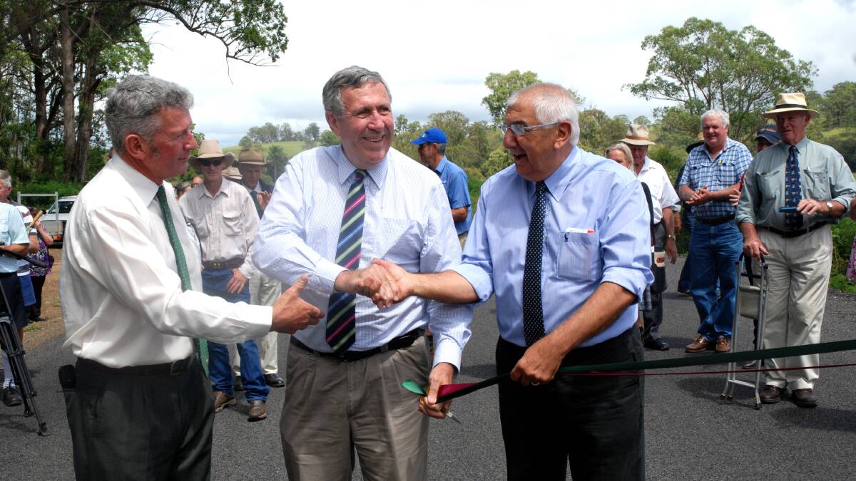 ROAD OPEN: Tenterfield Shire mayor Peter Petty, NSW Minister for Roads, Maritime and Freight Duncan Gay and Member for Lismore Thomas George officially open a completed section of the Mt Lindesay Rd on Friday. 