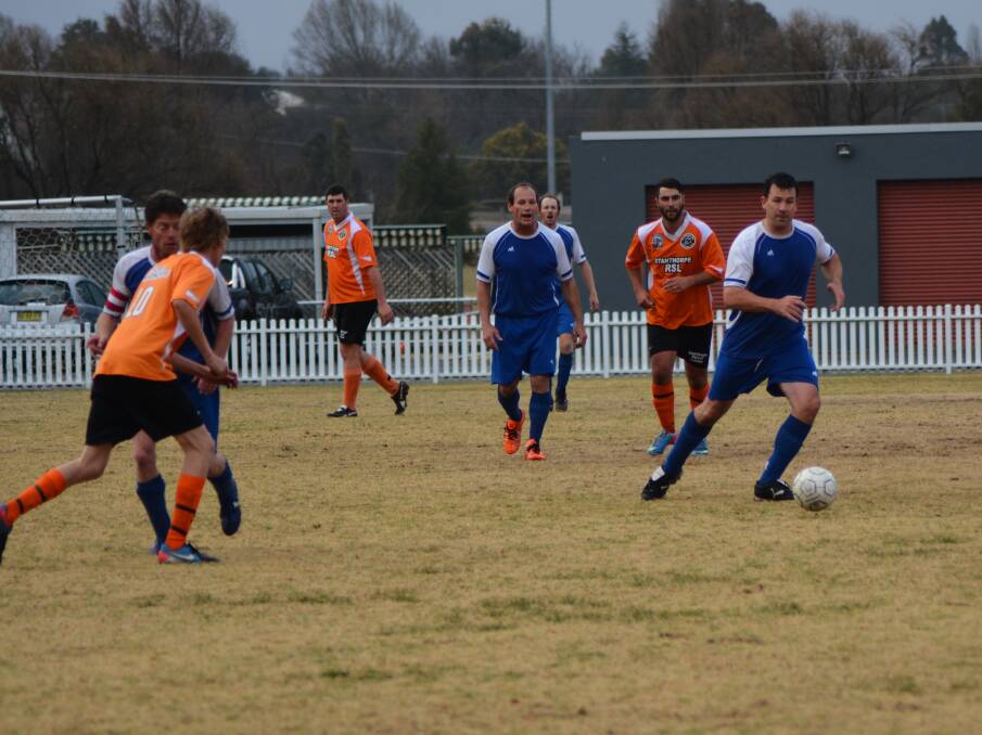 Brad Gallagher gets forward for Tenterfield in the men's final game of the season.
