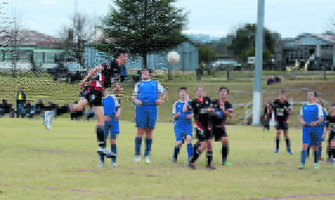 GOALWARD: Stanthorpe United's Kirby Morunga gets up high to meet the ball from a corner.