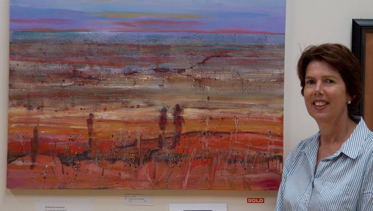 Linda Nye with her winning painting 'Spiritual song of the Aborigine'.