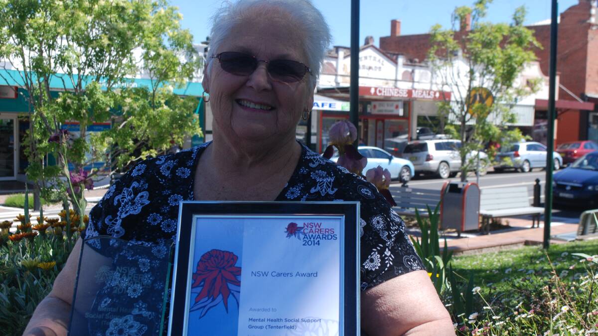 Diana Giles with the award she received from the state government for her work in the mental health sector.