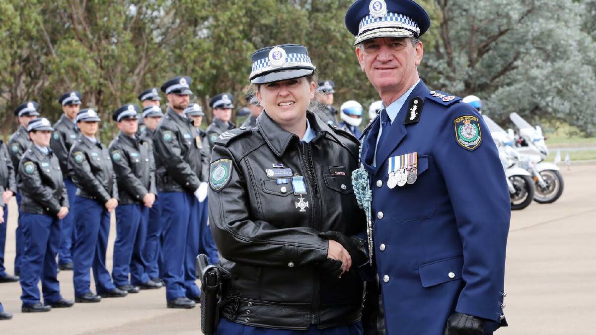 Former Tenterfield police officer Senior Constable Karen Peasley is presented with a valour award by NSW Police Commissioner Andrew Scipione.
 