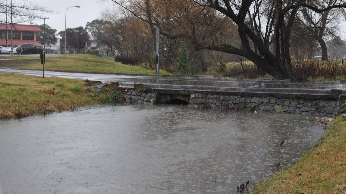 The Creeklands at the crossing with Dangar Street are nearly full, with motorists urged to take care when crossing the spillway.