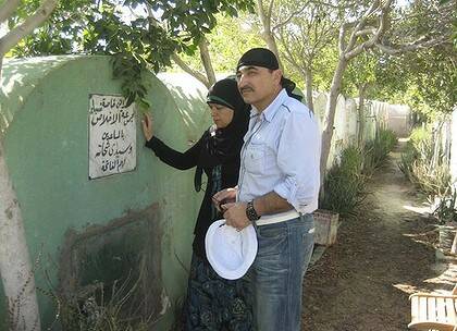 Emotional moment ... Egyptian-born Australian Mamdouh Habib, with his wife, Maha, breaks down at the graves of his father and sister outside Alexandria.