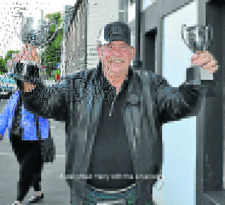 Harry Bolton with the cups.