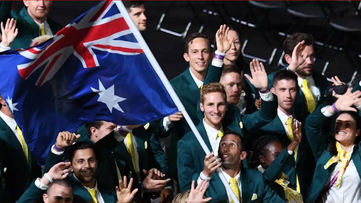  Flag bearer Mark Knowles leads the Australian team. Photo: AAP.