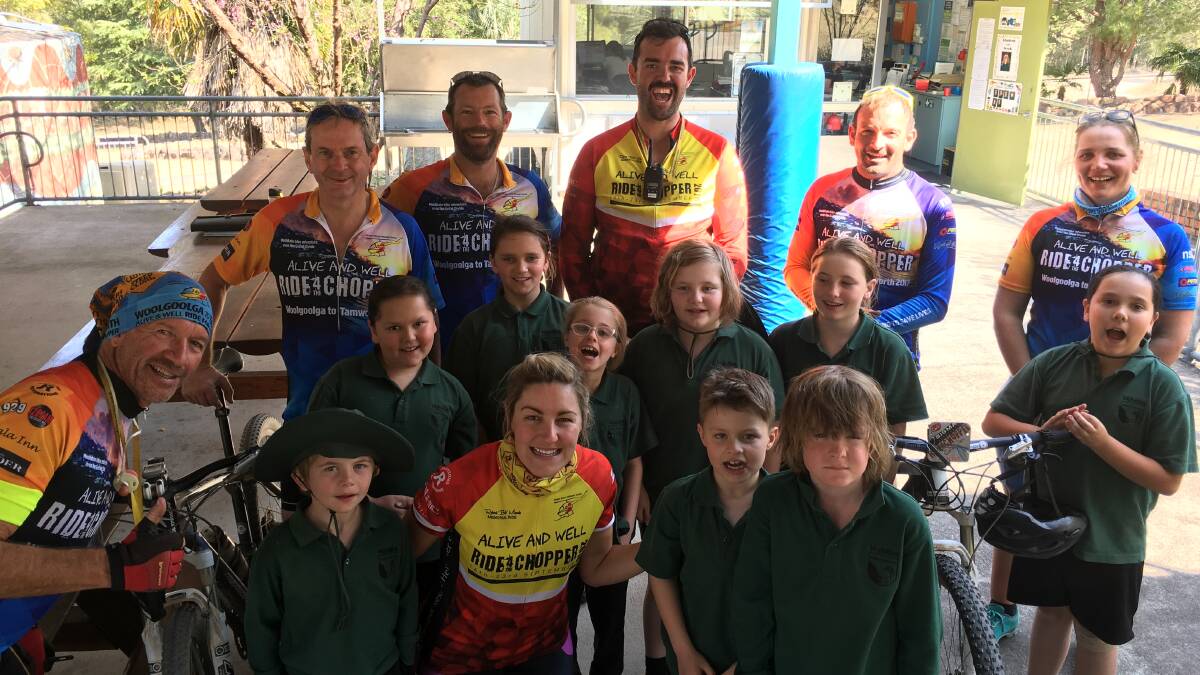 Important lesson: Some of the Ride for the Chopper team stopped into Wytalibah Public School to teach the kids the importance of wearing a helmet on a bike - a promise each child made to the crew.