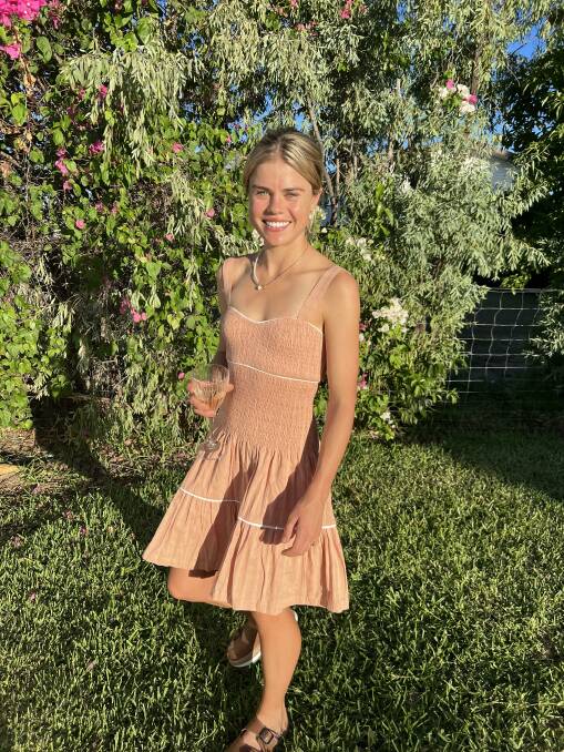 Emmi Lewis models one of the many summer dresses for sale on her site. Photos: Supplied