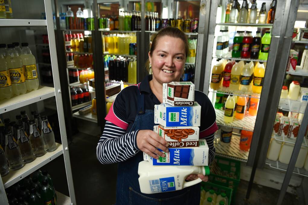 STOCKING UP: Gables East Take Away's Danielle Maclean has been selling multiple cartons of Kiewa milk and iced coffee, before they are all gone. Picture: MARK JESSER