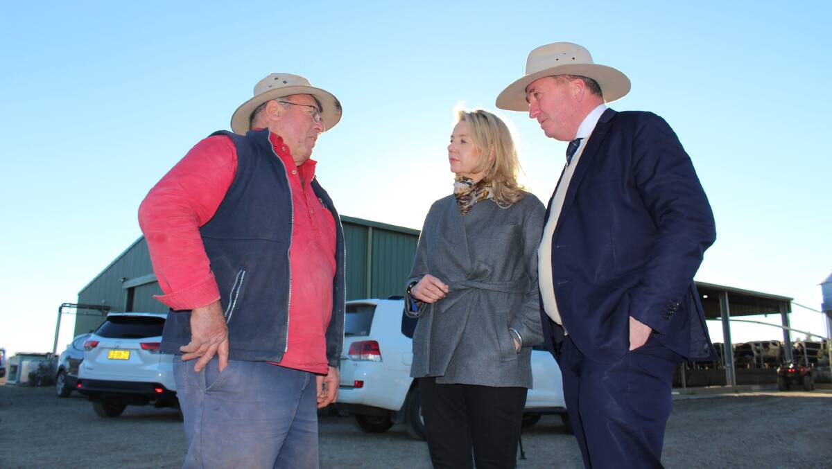 Mr Joyce and the Minister for Agriculture Senator Bridget McKenzie discussing ongoing drought conditions with a local farmer