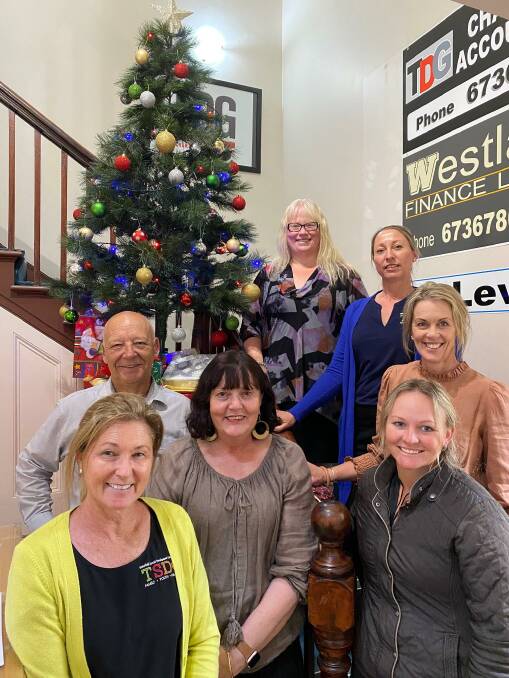 Giving Tree: Organisers of the Giving Tree program (not in order) Donna Simpson, Kellie Townsend, Deb O'Neill, Emily McMeniman, Julie Hurtz, Karen Mooney and Alan Donges welcome all gift donations.